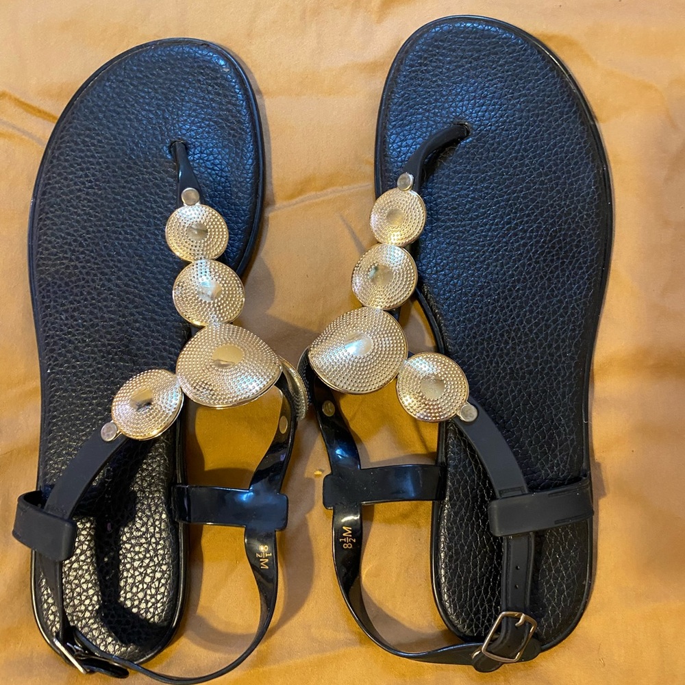 Plastic/rubber black size 8.5 gold and black sandals.